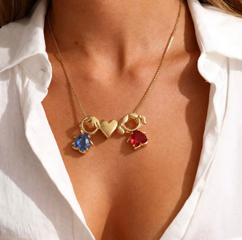 Close-up of family birthstone necklace with colored stones, gold plated