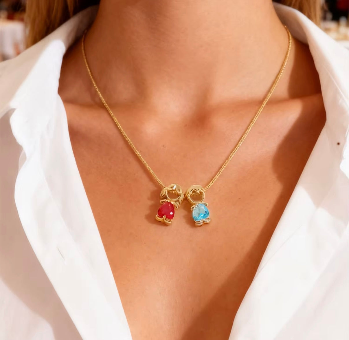 Woman wearing personalized mother and children birthstone necklace